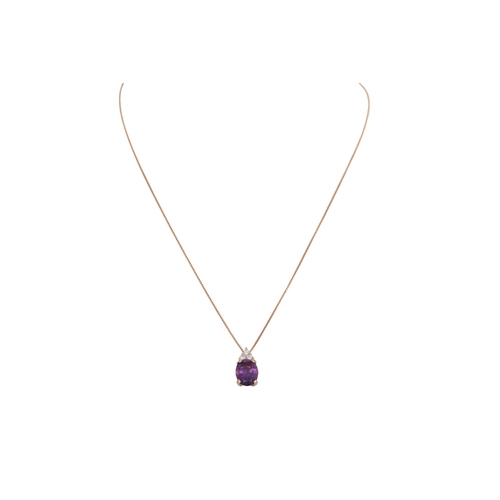 368 - AN AMETHYST AND DIAMOND PENDANT, the oval amethyst to brilliant cut diamonds mounted in 18ct yellow ... 