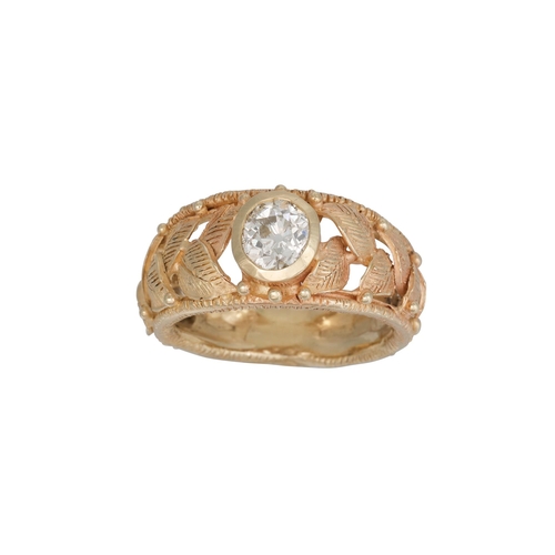 371 - A DIAMOND SOLITAIRE RING, the old cut diamond to a 14ct yellow gold mount with applied leaf decorati... 