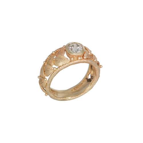 371 - A DIAMOND SOLITAIRE RING, the old cut diamond to a 14ct yellow gold mount with applied leaf decorati... 