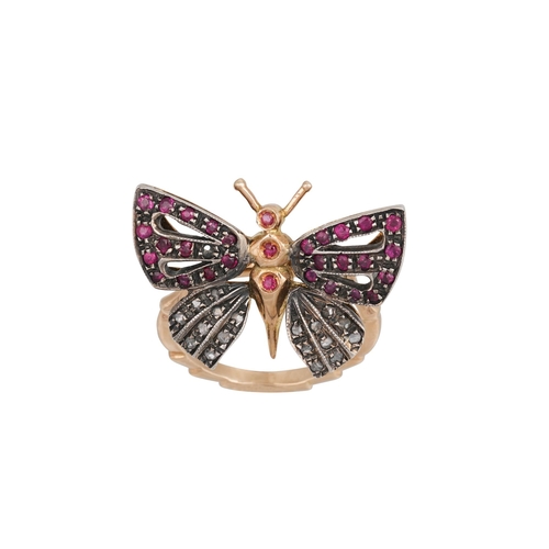 375 - A RUBY AND DIAMOND RING, modelled as a butterfly, mounted in 14ct white gold. Size: N - O