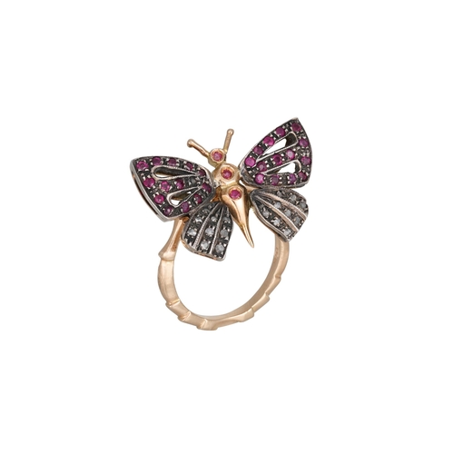 375 - A RUBY AND DIAMOND RING, modelled as a butterfly, mounted in 14ct white gold. Size: N - O