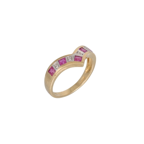 38 - A DIAMOND AND RUBY ETERNITY RING, the shaped band channel set, mounted in 9ct yellow gold, size M – ... 