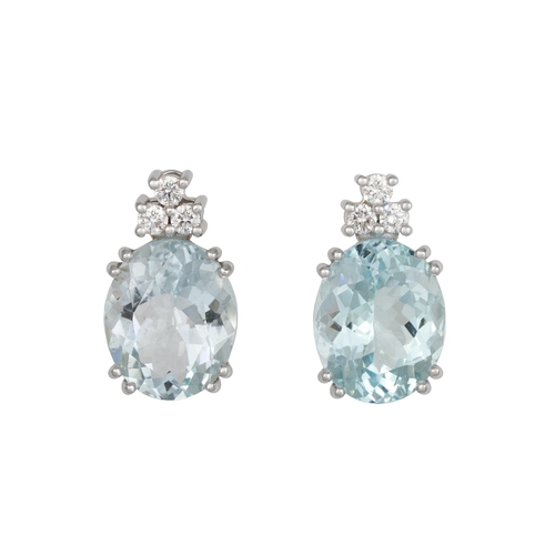 387 - A PAIR OF AQUAMARINE AND DIAMOND EARRINGS, the oval aquamarines to trios of brilliant cut diamonds, ... 