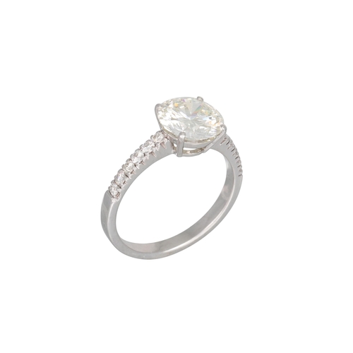 388 - A DIAMOND SOLITAIRE RING, the brilliant cut diamond to diamond shoulders, mounted in 18ct white gold... 