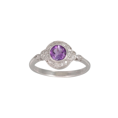 4 - AN AMETHYST AND DIAMOND CLUSTER DRESS RING, mounted in 9ct white gold, size I - J