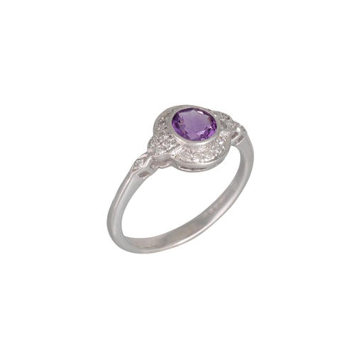 4 - AN AMETHYST AND DIAMOND CLUSTER DRESS RING, mounted in 9ct white gold, size I - J