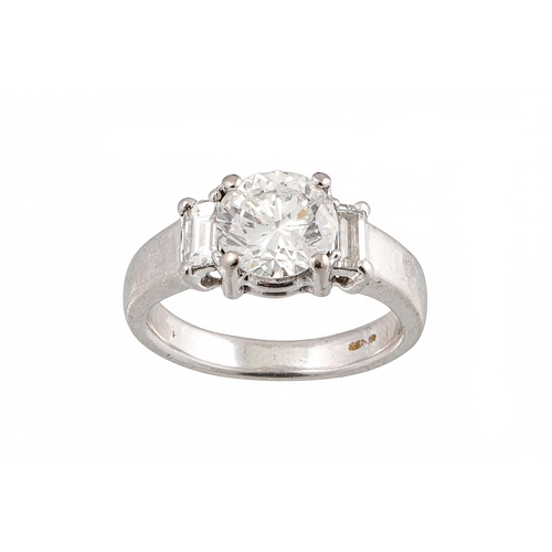 403 - A DIAMOND SOLITAIRE RING, the brilliant cut diamond to diamond shoulders, mounted in white gold. Est... 