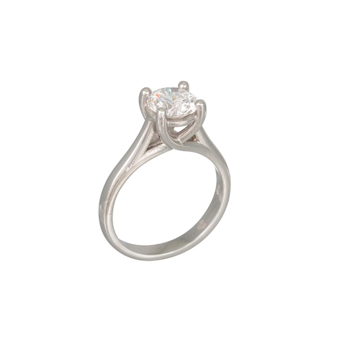 404 - A DIAMOND SOLITAIRE RING, the round brilliant cut diamond mounted in platinum (.950). Together with ... 