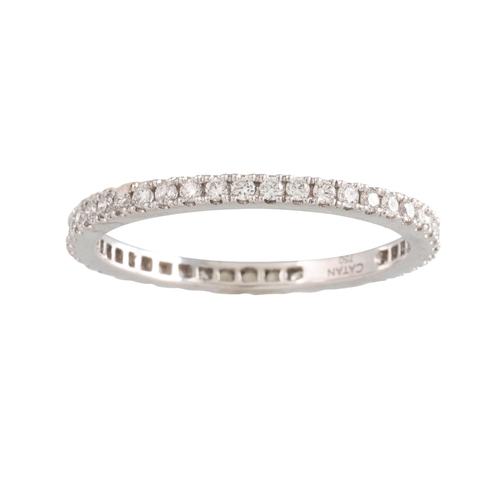 411 - A DIAMOND ETERNITY RING, the brilliant cut diamonds mounted in 18ct white gold. Estimated: weight of... 