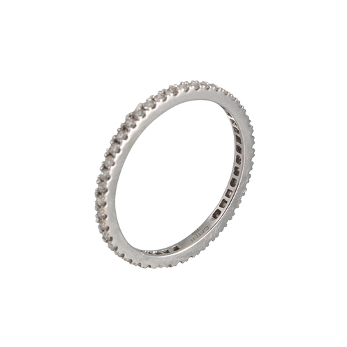 411 - A DIAMOND ETERNITY RING, the brilliant cut diamonds mounted in 18ct white gold. Estimated: weight of... 