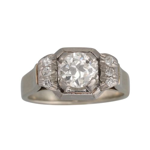 416 - AN ART DECO DIAMOND RING, the old cut diamond to a square mount, diamond shoulders, French hallmarks... 