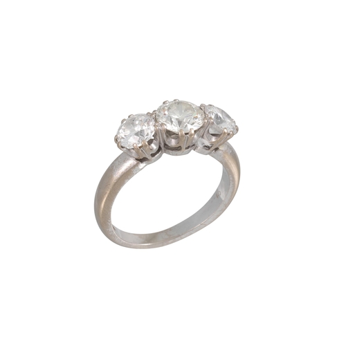 421 - A THREE STONE DIAMOND RING, the brilliant cut diamonds mounted in 18ct white gold. Estimated: weight... 