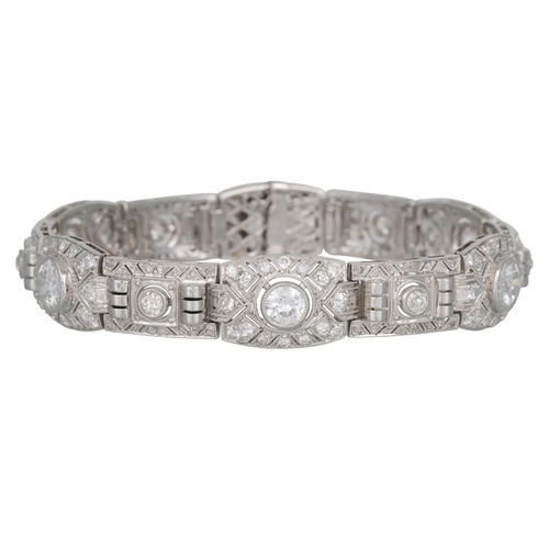 435 - AN ART DECO DIAMOND BRACELET, c 1930s of openwork geometric design, set throughout with old cut diam... 