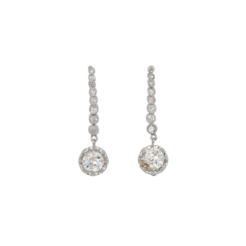 437 - A PAIR OF MID CENTURY DIAMOND DROP EARRINGS, the diamond lines suspending circular diamond drops, c.... 