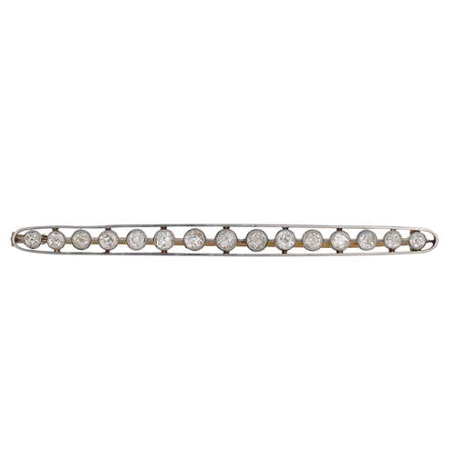 438 - AN EARLY 20TH CENTURY DIAMOND BAR BROOCH, the old cut diamonds mounted in 18ct yellow gold, French h... 