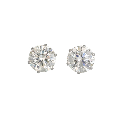 450 - A PAIR OF DIAMOND STUD EARRINGS, the brilliant cut diamonds mounted in 18ct white gold. Estimated: w... 