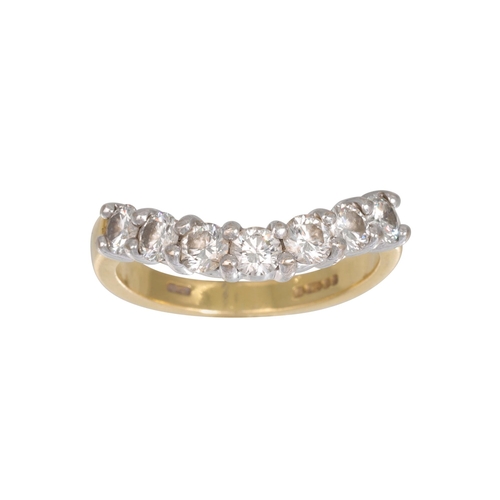 451 - A SEVEN STONE DIAMOND RING, the brilliant cut diamonds to a shaped 18ct yellow gold band. Estimated:... 