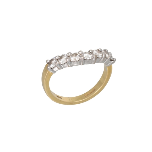 451 - A SEVEN STONE DIAMOND RING, the brilliant cut diamonds to a shaped 18ct yellow gold band. Estimated:... 