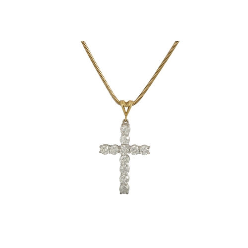 452 - A DIAMOND SET CROSS, the brilliant cut diamonds mounted in yellow gold, on a yellow gold chain. Esti... 