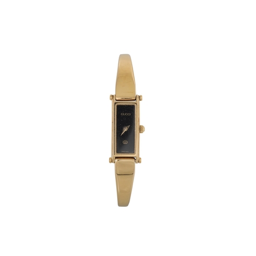 475 - A LADY'S GUCCI WRIST WATCH, horse bit bracelet strap, black face