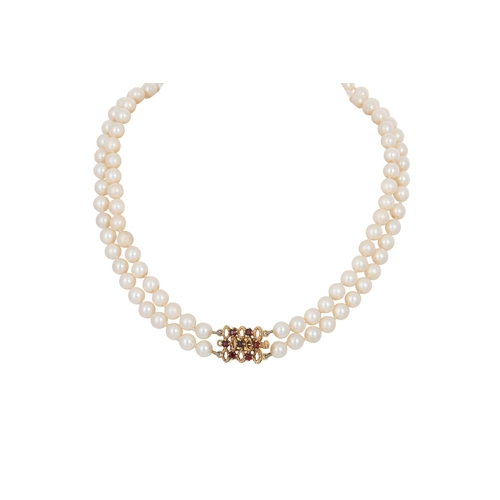 51 - A 1980S TWO ROW CULTURED PEARL NECKLACE, to a 9ct yellow gold and garnet set clasp with bark finish,... 