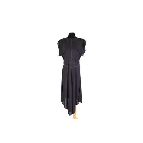 565 - A LADY'S ALAIA PARIS BLACK EVENING DRESS, the viscose fabric with split flutter sleeves and tie deta... 