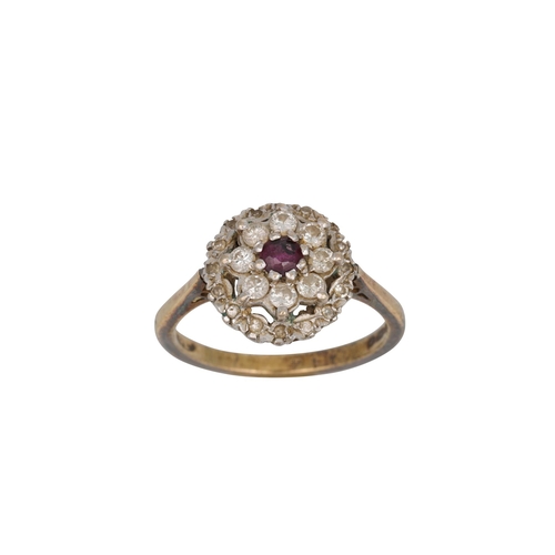 58 - A RUBY AND DIAMOND CLUSTER DRESS RING, mounted in 18ct gold, size L