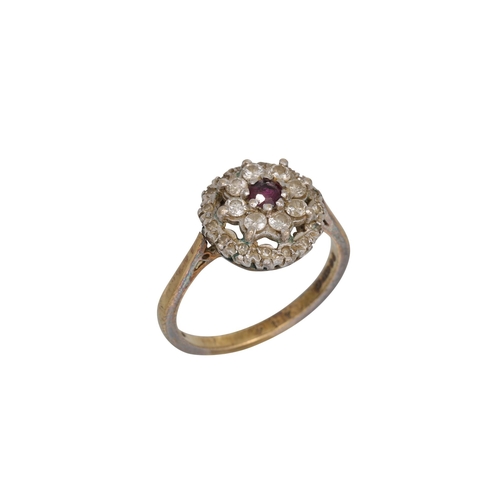 58 - A RUBY AND DIAMOND CLUSTER DRESS RING, mounted in 18ct gold, size L