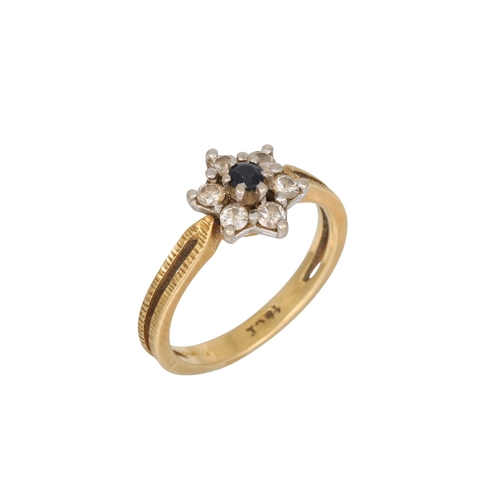 61 - A DIAMOND AND SAPPHIRE CLUSTER RING, mounted in 18ct gold, bark finish, size M