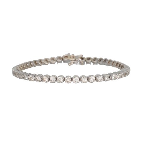 79 - A DIAMOND LINE BRACELET, the brilliant cut diamonds mounted in 18ct white gold, 19 cm. Estimated: we... 