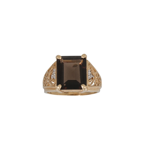 90 - A SMOKY QUARTZ SET DRESS RING, mounted in 10ct yellow gold, to open work shoulders, size N