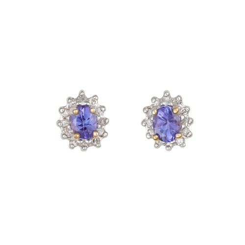 93 - A PAIR OF DIAMOND AND TANZANITE CLUSTER EARRINGS, mounted in white gold