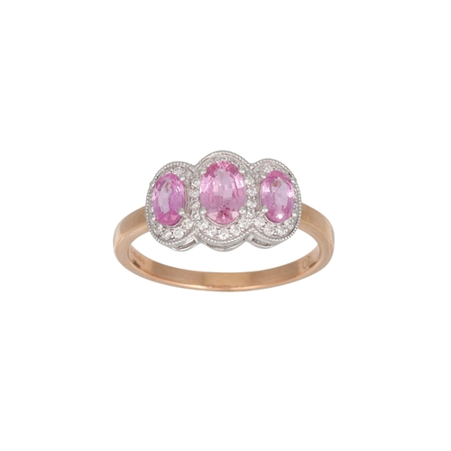 94 - A PINK SAPPHIRE AND DIAMOND TRIPLE CLUSTER RING, the three oval pink sapphires to diamonds surrounds... 