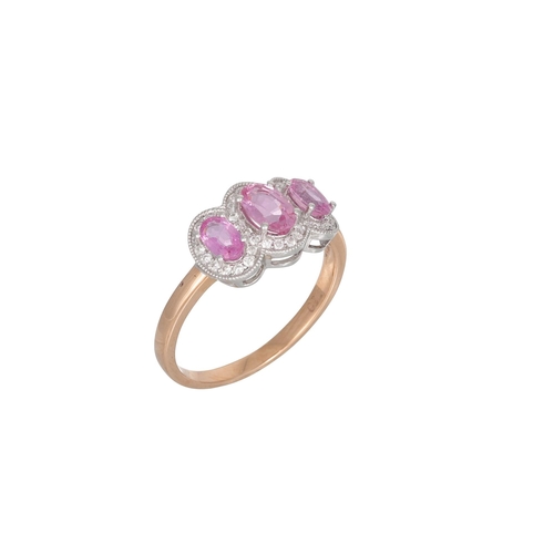 94 - A PINK SAPPHIRE AND DIAMOND TRIPLE CLUSTER RING, the three oval pink sapphires to diamonds surrounds... 