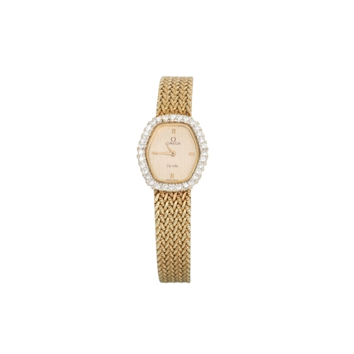 99 - A LADY'S OMEGA WRIST WATCH, gilt dial, diamond bezel, 14ct yellow gold mesh strap