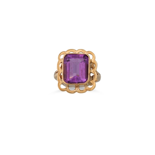 63 - AN AMETHYST RING, the large rectangulat cut amethyst to a gold mount, size L