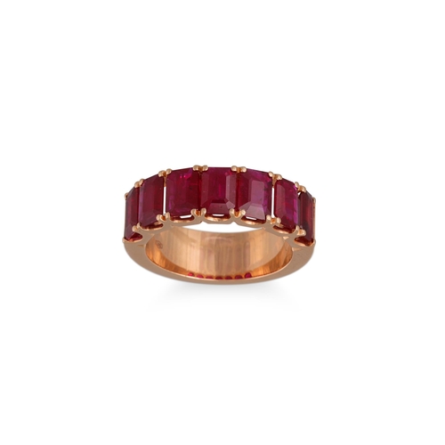 127 - A SEVEN STONE RUBY RING, the emerald cut stones mounted in 18ct yellow gold. Estimated: weight of ru... 