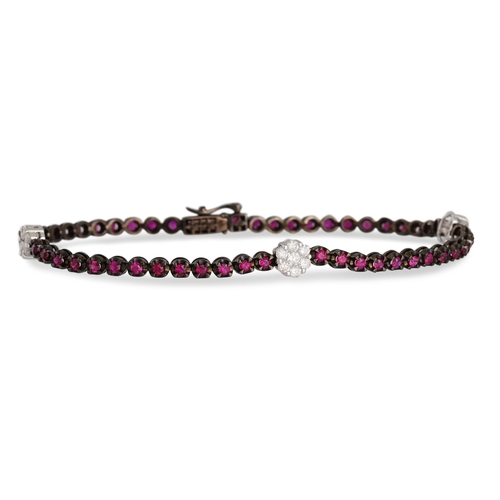 136 - A RUBY AND DIAMOND BRACELET, the line of rubes interspersed with three diamond clusters, mounted in ... 