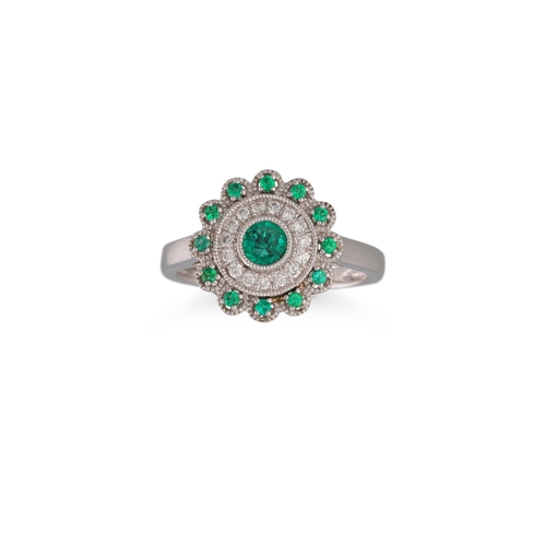 34 - A DIAMOND AND EMERALD CLUSTER RING, of circular form, mounted in 18ct white gold, size O