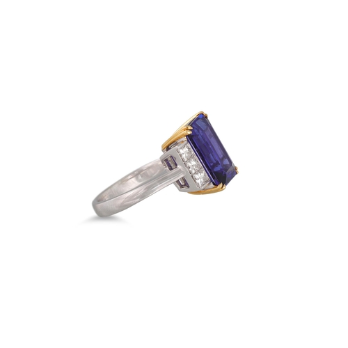 384 - A TANZANITE RING, the rectangular stone to diamond shoulders. Estimated: weight of tanzanite: 8.19 c... 