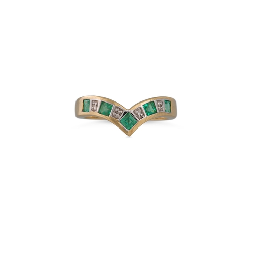 46 - A DIAMOND AND EMERALD ETERNITY RING, V-shaped, mounted in gold, size M - N