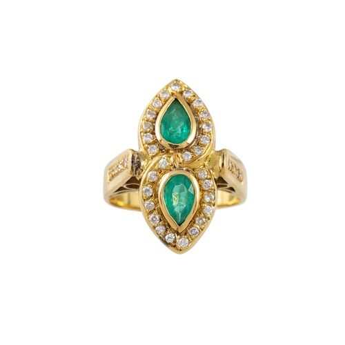 49 - A DIAMOND AND EMERALD DOUBLE CLUSTER RING, comprising two pear shaped clusters, mounted in yellow go... 