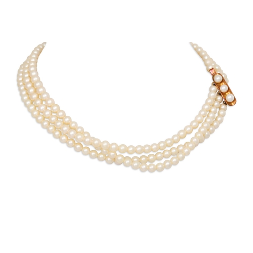 50 - A TRIPLE ROWED CULTURED PEARL CHOKER NECKLACE, with a 14ct gold clasp, boxed