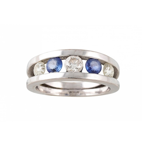 55 - A SAPPHIRE AND DIAMOND FIVE STONE RING, the graduated stones tension set in a white gold, size J - K