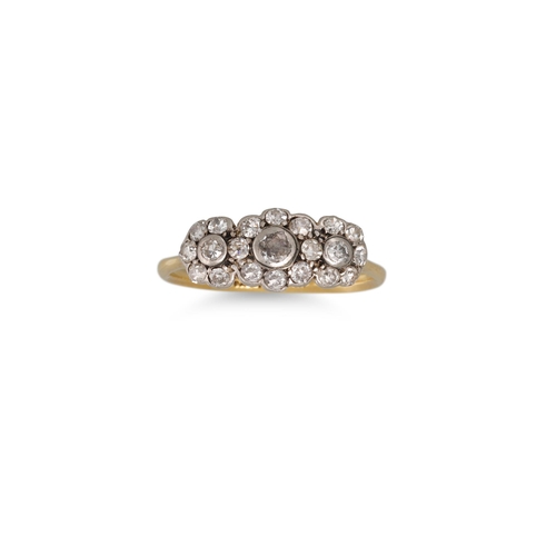 64 - A VINTAGE DIAMOND TRIPLE CLUSTER RING, mounted in 18ct gold & platinum. Estimated: weight of diamond... 