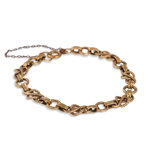 73 - A 9CT YELLOW GOLD FANCY LINK BRACELET, 11 g.