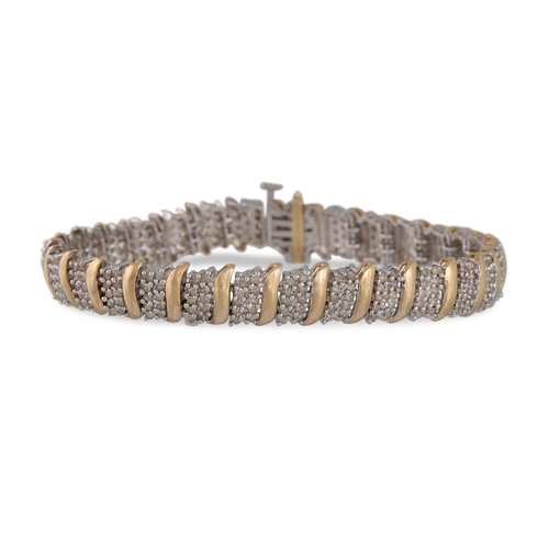 93 - A DIAMOND CLUSTER LINE BRACELET, the round brilliant cut diamonds mounted in white gold to yellow go... 