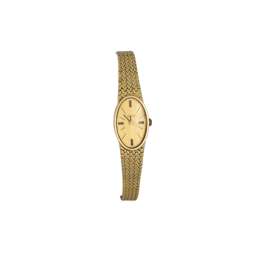 5 - A 14CT GOLD OVAL FACED “TOURIST” LADY'S WRISTWATCH, 28.6 g.