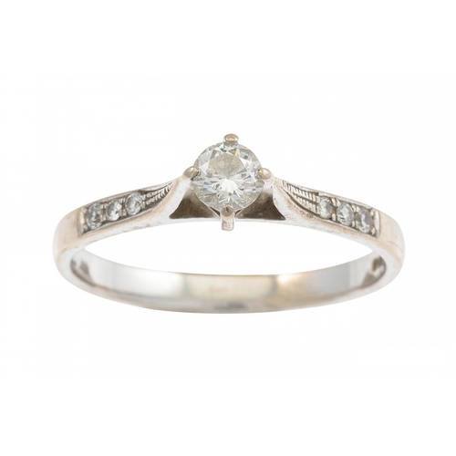 68 - A DIAMOND SOLITAIRE RING, the round brilliant cut diamonds with diamond set shoulders mounted in whi... 