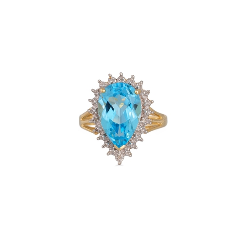 96 - A DIAMOND AND BLUE TOPAZ RING, the pear shaped topaz to diamond surround, mounted in 9ct yellow gold... 